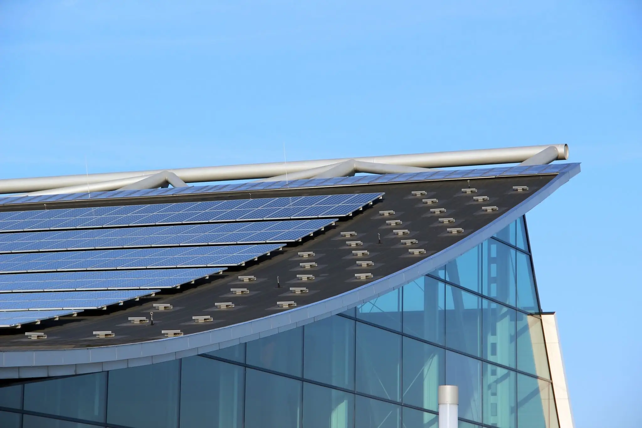 Modern building with rooftop solar panels.