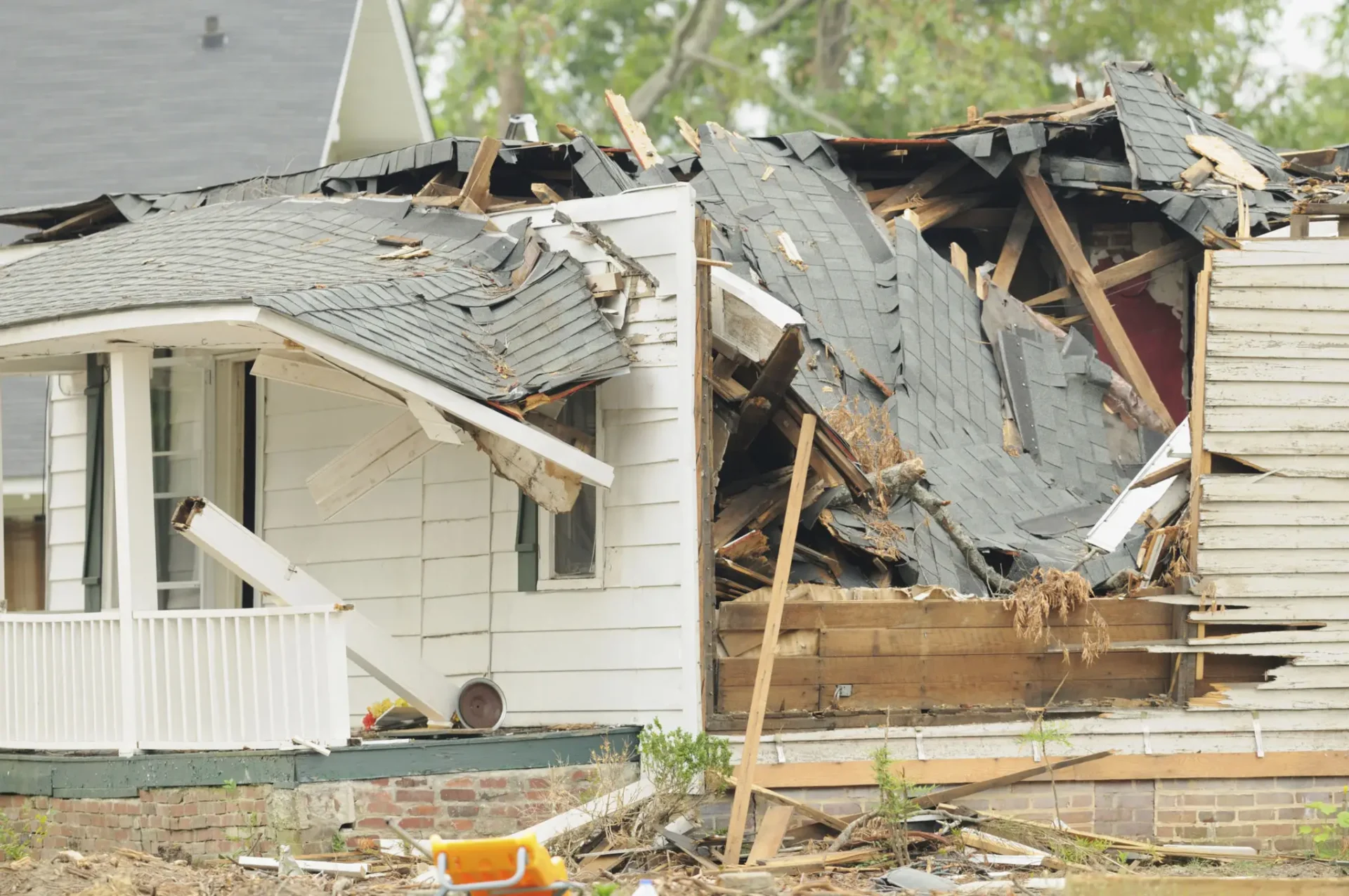Collapsed roof on white house